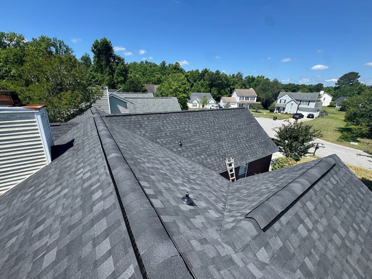 Completed residential roof overlooking the surrounding neighborhood