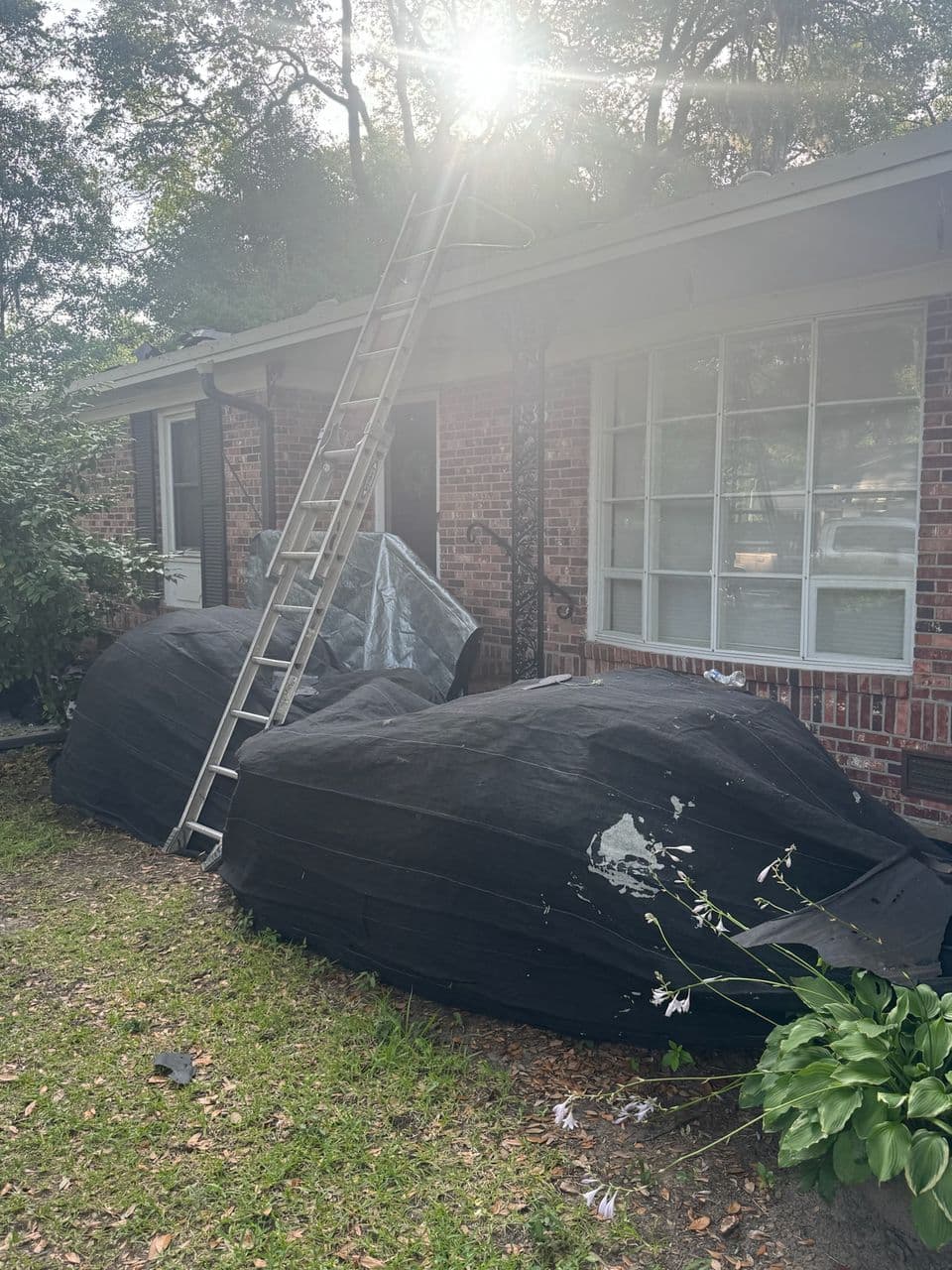 Ground protection set up around a home during a roofing project