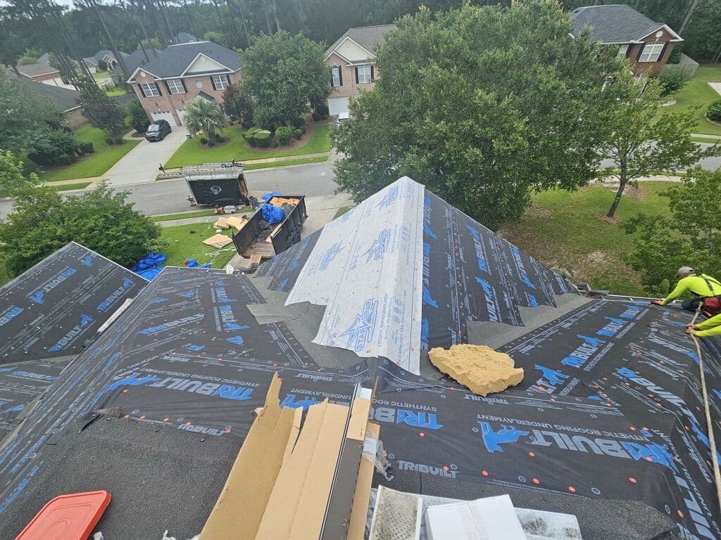 Tucker Contractors roofing crew during a roof tear-off and underlayment installation