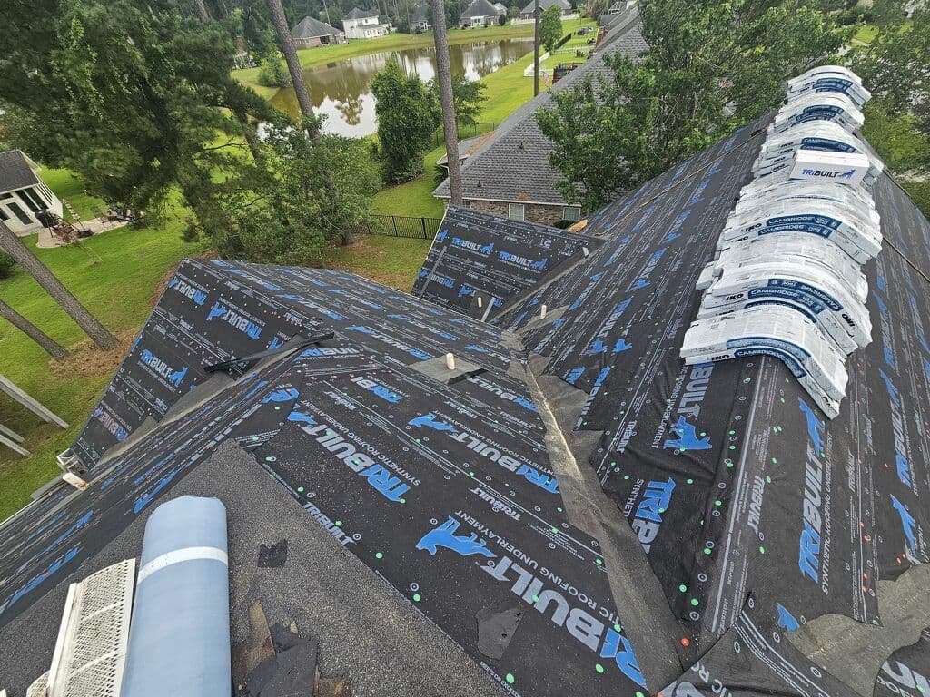 New shingle bundles staged on the roof for installation