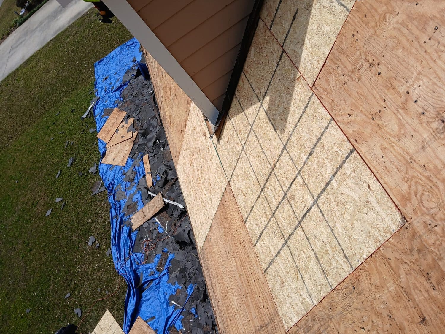 A worn out residential roof with curling and missing shingles in Charleston